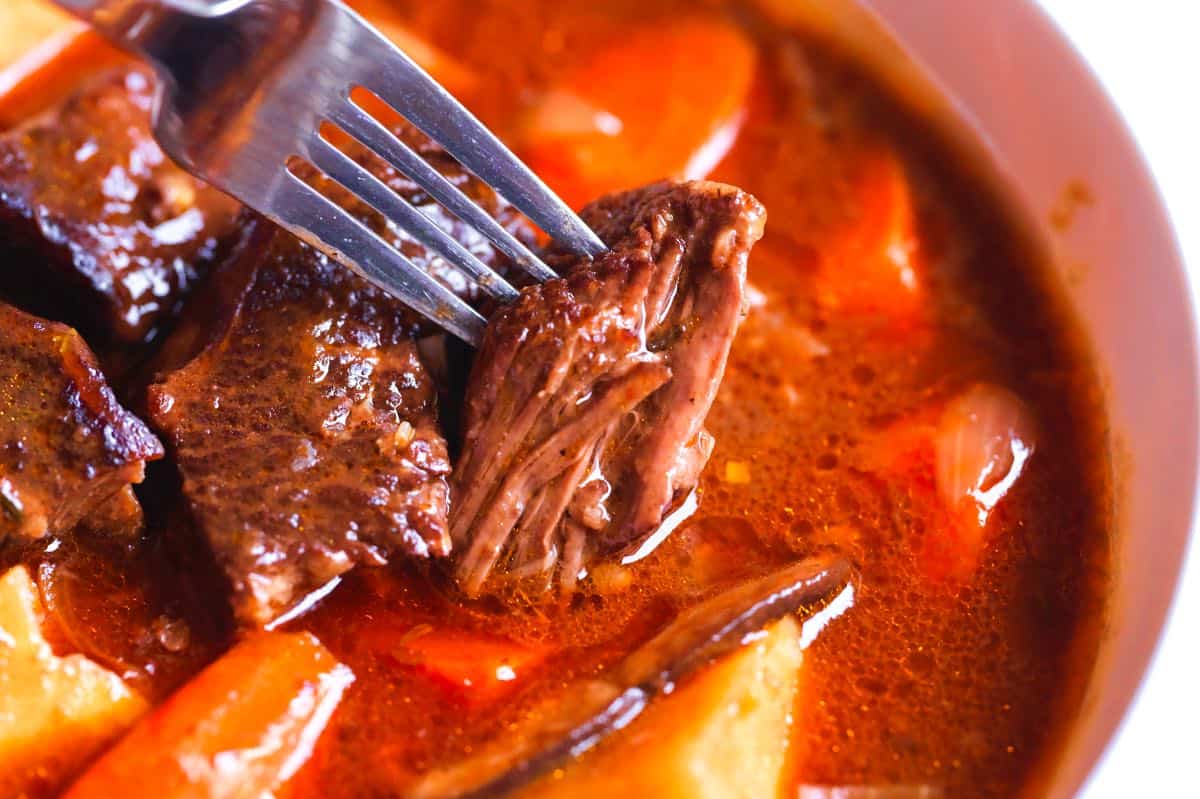 Classic beef stew featuring incredibly tender, melt-in-your-mouth beef
