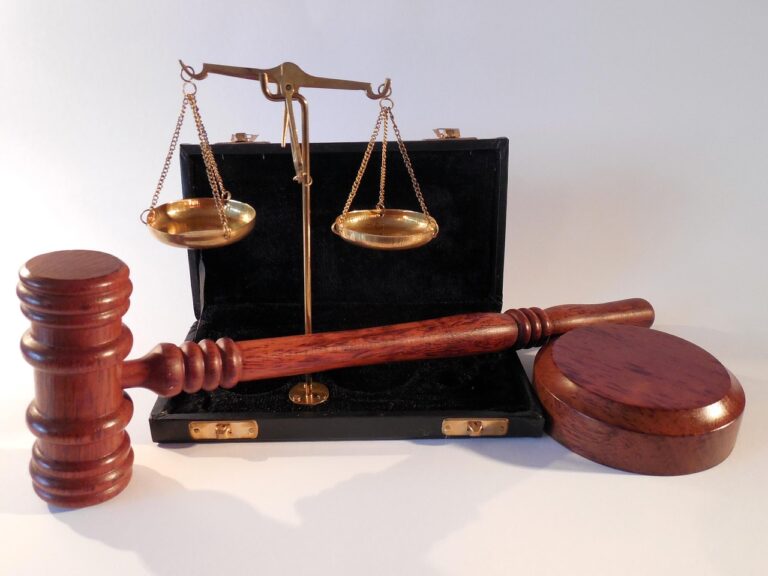 Hands holding a tablet with legal documents, representing financial regulations